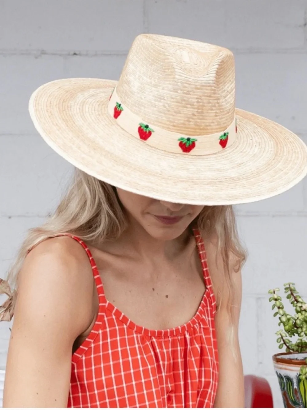 Wide brim straw hat with strawberry trim